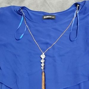 Blue dress with gold chain attached to it